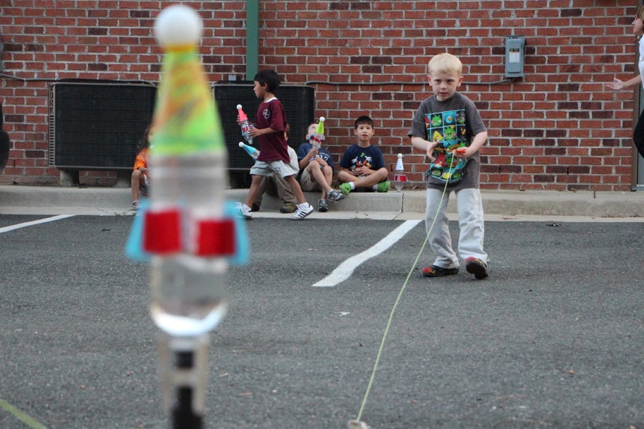 child participates in STEM education activity 