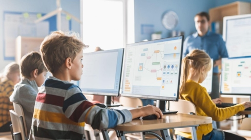 A young boy playing Mission to Mars Minecraft program at a summer camp.p